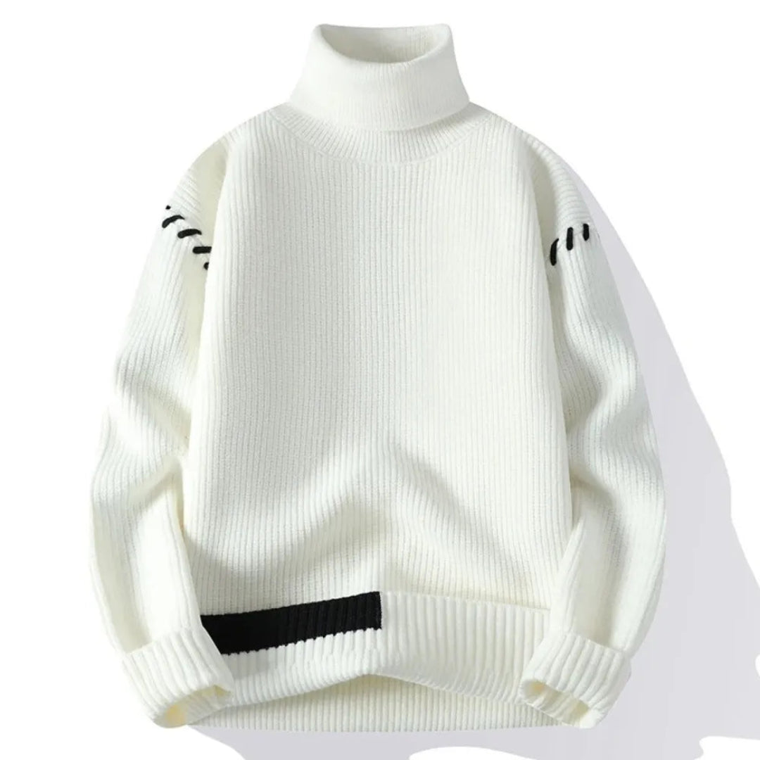 Stickad tröja med ståkrage och lapptäcksdesign