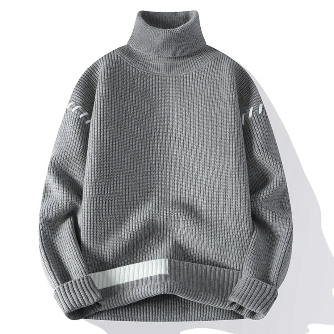 Stickad tröja med ståkrage och lapptäcksdesign